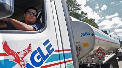 Hieu Hoang waits in line for his turn to fill his tanker at one of the Doraville pipeline terminals. The gas shortage in metro Atlanta was already easing Wednesday, with pipeline repairs expected to restore the flow soon. BOB ANDRES /BANDRES@AJC.COM