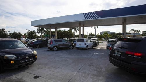 Lines form at a gas station in Lake Worth, Fla., on Aug. 29, 2019, as Hurricane Dorian approaches the Florida coast. Dorian is moving northwest and currently drawing strength from the warm waters of the Atlantic. It is expected to make landfall in Florida on Sept. 2. Georgians are keeping an eye on the storm and also preparing for a possible influx of evacuees from Florida. SAUL MARTINEZ / THE NEW YORK TIMES)