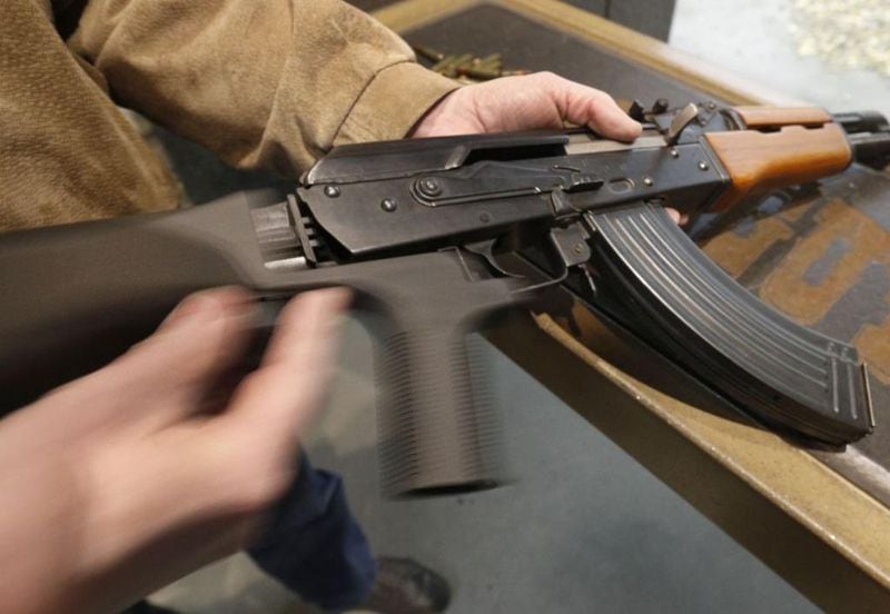 A bump stock  is installed on an AK-47 and its movement is demonstrated at Good Guys Gun and Range on February 21, 2018 in Orem, Utah. The bump stock is a device when installed allows a semi-automatic to fire at a rapid rate much like a fully automatic gun. 