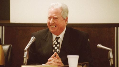 DeKalb County School Superintendent Robert Freeman laughs after making a comment after his announcement to the DeKalb school board in June 1996 that he would be resigning.