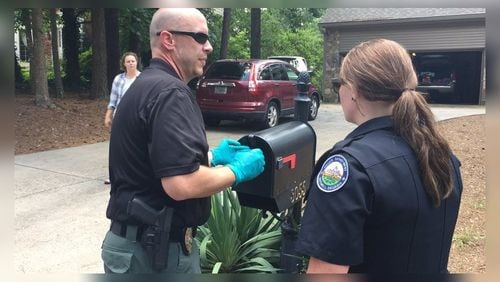 Roswell police investigate a suspicious package report in Karen Handel's neighborhood Thursday. (Credit: Channel 2 Action News)