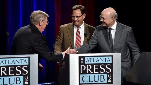 Georgia's three U.S. Senate candidates shake hands ahead of the race's only televised debate last month. BRANT SANDERLIN/BSANDERLIN@AJC.COM