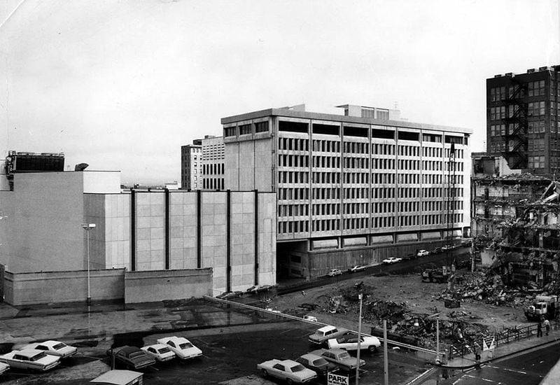 The new home for the Journal and Constitution can be seen in the background at the 10 Forsyth building is demolished in front. (Bill Mahan/AJC file)