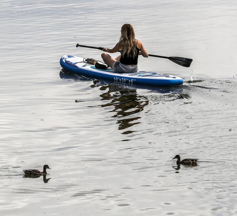 A paddler in Sandy Springs. Gov. Brian Kemp signed legislation Tuesday that he said preserves the public right to hunt, fish and transit navigable waterways across Georgia — a “privilege that has been assured Georgians for generations.” (John Spink / John.Spink@ajc.com)

