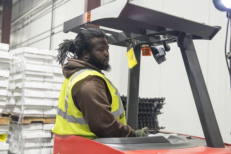 Larry Butler drives a forklift at Lineage Logistics in Albany. At first he walked to work because he doesn’t have a car. Now he rides with a co-worker. (ALYSSA POINTER/ALYSSA.POINTER@AJC.COM)