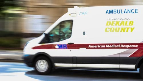 An AMR ambulance leaves Grady Memorial Hospital earlier this year. JOHN SPINK/JSPINK@AJC.COM