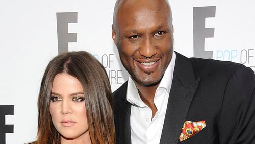 FILE - In this April 30, 2012 file photo, Khloe Kardashian Odom and Lamar Odom from the show "Keeping Up With The Kardashians" attend an E! Network upfront event at Gotham Hall in New York. Odom, the former NBA star and reality TV personality embraced by teammates and fans alike for his humble approach to fame, was hospitalized and his estranged wife Khloe Kardashian is by his side, after being found unresponsive in a Nevada brothel where he had been staying for days. (AP Photo/Evan Agostini, File)