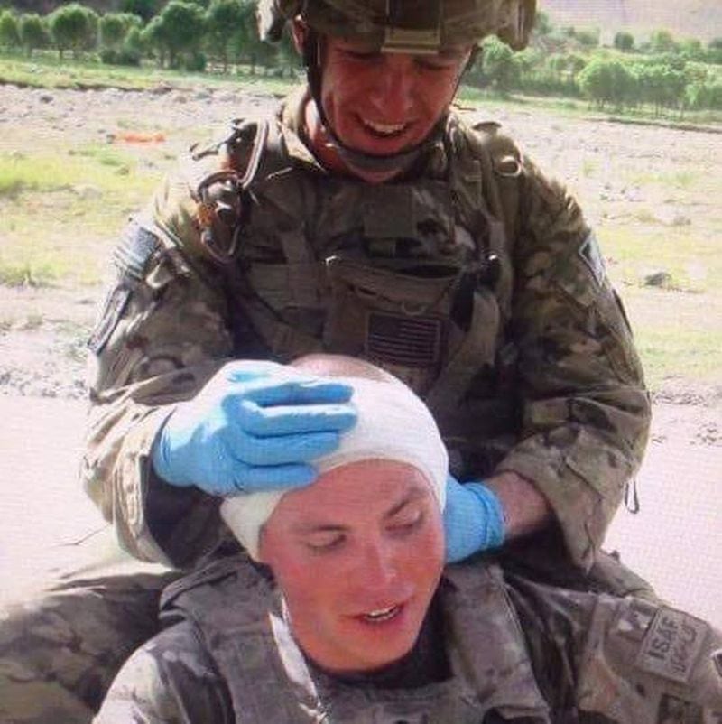 Former U.S. Army soldier Chris Weakley (above) performs first aid on a security officer stabbed in the head. Weakley, 33, is now a student at Emory University, majoring in finance. CONTRIBUTED