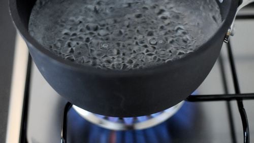 In this photo illustration, water comes to the boil on a gas stove. The hot water challenge on YouTube is drawing concern from parents once again. (Photo by Vittorio Zunino Celotto/Getty Images)