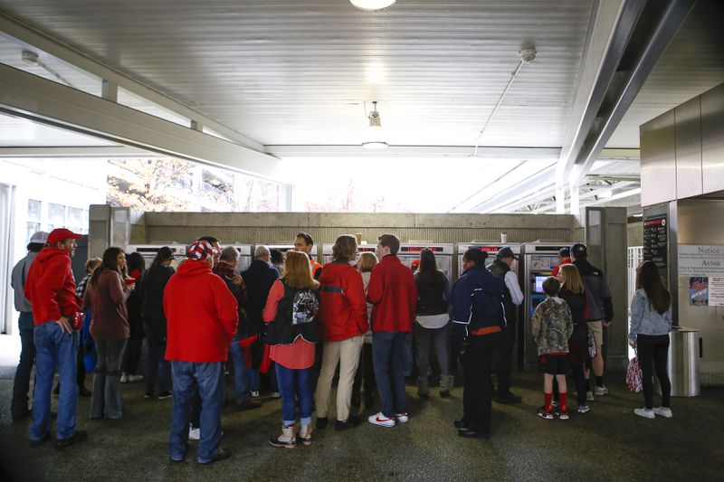 The Atlanta Police Department hopes fans use MARTA to get to the upcoming Super Bowl, just as many college football fans did during the recent SEC Championship (pictured). The department plans to close roads and lanes in the days leading up to the Feb. 3 Super Bowl. (Casey Sykes for The Atlanta Journal-Constitution)