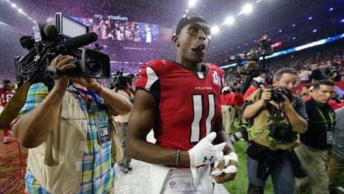 FEBRUARY 5, 2017 HOUSTON TX Atlanta Falcons wide receiver Julio Jones (11) leaves the field at the end of the game as the Atlanta Falcons meet the New England Patriots in Super Bowl LI at NRG Stadium in Houston, TX, Sunday, February 5, 2017. The Patriots beat the Falcons in OT 34-28. Curtis Compton/AJC