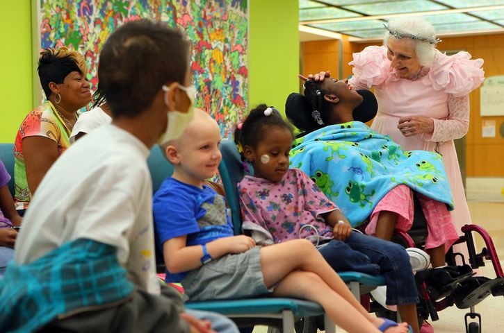 Staff photographer Curtis Compton captures the magic of 91-year-old Jackie Viener as she brings hope, joy and secret wishes to hospitalized children.