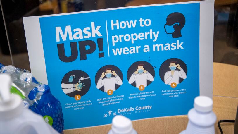 07/23/2021 — Decatur, Georgia — Signs advising DeKalb County School District visitors how to wear a mask will be displayed in the hallways of the school buildings, like this one, displayed at Kelley Lake Elementary School in Decatur, Friday, July 23, 2021. (Alyssa Pointer/Atlanta Journal Constitution)