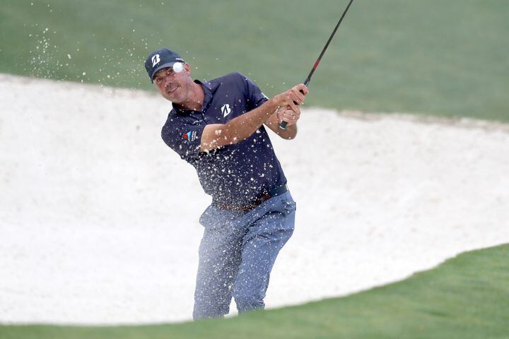 April 8, 2021, Augusta: Matt Kuchar hits out of the bunker on the tenth hole during the first round of the Masters at Augusta National Golf Club on Thursday, April 8, 2021, in Augusta. Curtis Compton/ccompton@ajc.com