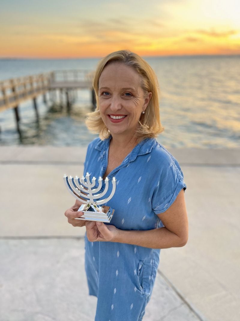 Jennifer Marshall, who was raised Catholic, shows off the memorah she bought and displayed as a means of comforting her Jewish friends and combatting antisemitism. Photo: Jennifer Marshall