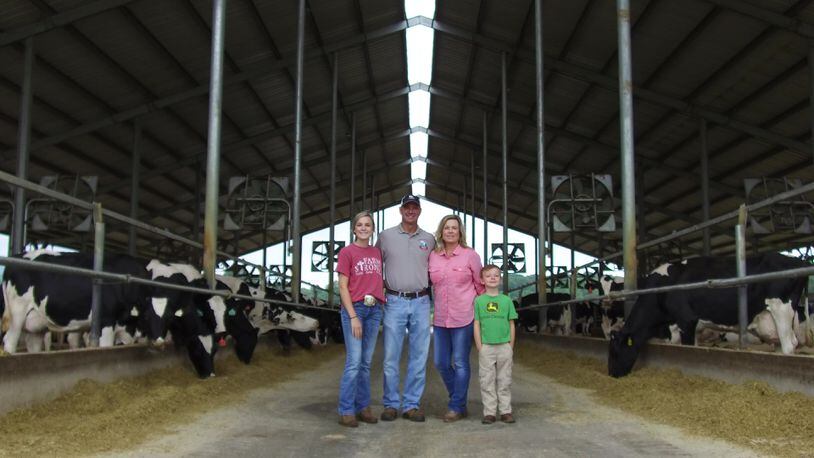 Scott and Jen Glover, seen with their children Eliza Jane (left) and Layne (right), run Glo-Crest Dairy and Mountain Fresh Creamery. Courtesy of Mekenzie Panhans