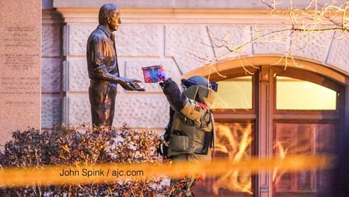 A statue of former President Jimmy Carter was searched for a suspicious substance. JOHN SPINK / JSPINK@AJC.COM