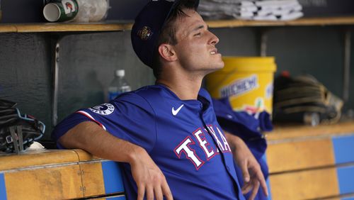Texas Rangers pitcher Jack Leiter watches from the dugout after being pulled against the Detroit Tigers in the fourth inning of a baseball game, Thursday, April 18, 2024, in Detroit. (AP Photo/Paul Sancya)