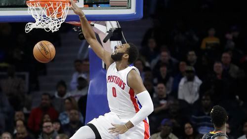 Detroit Pistons center Andre Drummond (0) dunks during the first half of an NBA basketball game against the Atlanta Hawks, Wednesday, Jan. 18, 2017, in Auburn Hills, Mich. (AP Photo/Carlos Osorio)