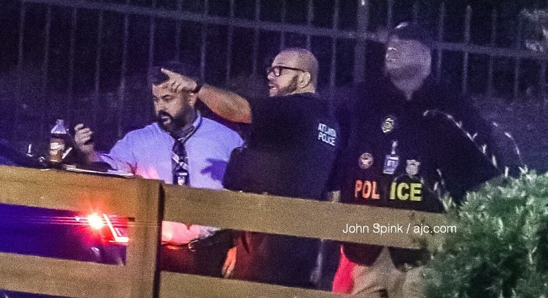 Atlanta police investigate a deadly shooting at an apartment complex on McDaniel Street in southwest Atlanta on Tuesday morning. JOHN SPINK / JSPINK@AJC.COM