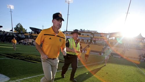 September 12, 2015 - Kennesaw, Ga: Kennesaw State University head coach Brian Bohannon runs off of the field after their game against Edward Waters at Fifth Third Bank Stadium, Saturday, September 12, 2015, in Kennesaw, Ga.. KSU won 58-7. This is the first home game of KSU's inaugural football season. PHOTO / JASON GETZ