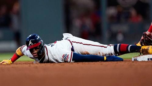 Ronald Acuna steals second base in the sixth inning of the team's baseball game against the St. Louis Cardinals on Thursday, June 17, 2021, in Atlanta.