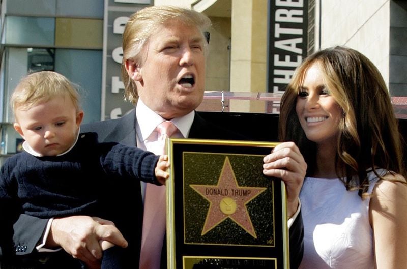 Donald Trump poses with son Barron and wife Melania at his Hollywood Walk of Fame ceremony in 2007. IMAGE: DAMIAN DOVARGANES/ASSOCIATED PRESS