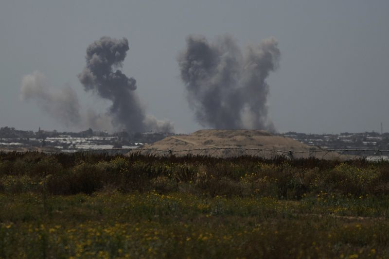 Smoke rises following an Israeli bombardment in the Gaza Strip as seen from southern Israel, Tuesday, May 7, 2024. (AP Photo/Leo Correa)