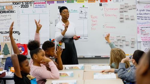 Henry County teacher Samantha Hawthrone (cq) is getting back to basics in her third-grade classroom at Austin Road Elementary in Stockbridge. An early November breach of the south metro Atlanta school system's network force the district to restrict access to the internet, which means computers, a mainstay in today's classrooms, were pushed aside for basic pencil and paper. Miguel Martinez /miguel.martinezjimenez@ajc.com