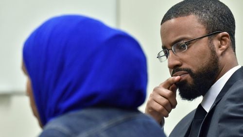 Aisha Hussain, sister of Shukri Ali Said, talks about her sister’s death as Edward Ahmed Mitchell (background), CAIR-GA executive director, looks at her on July 17, 2018. In April, a 36-year-old Muslim American woman, Shukri Ali Said, was shot to death by Johns Creek police after they say she refused to drop a knife. There have been community memorial events for the woman, who suffered from mental illness. HYOSUB SHIN / HSHIN@AJC.COM