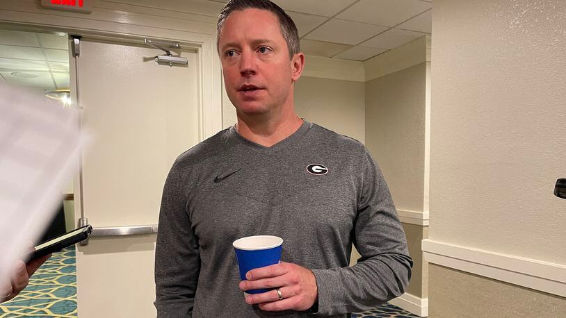 Georgia basketball coach Mike White sips a coffee while fielding reporters' questions on the first day of the SEC Spring Meetings in Destin at the Hilton Sandestin Resort on Tuesday, May 30, 2023, in Miramar Beach, Fla. (Photo by Chip Towers/ctowers@ajc.com)