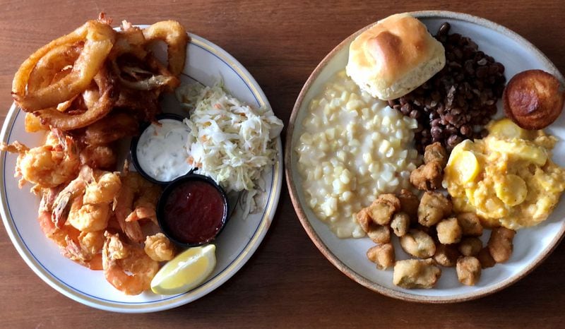 Colonnade takeout at home: Fried shrimp with onion rings and coleslaw; veggie plate with creamed corn; crowder peas, seasonal squash, fried okra, yeast roll and a corn muffin. (Wendell Brock for The Atlanta Journal-Constitution)