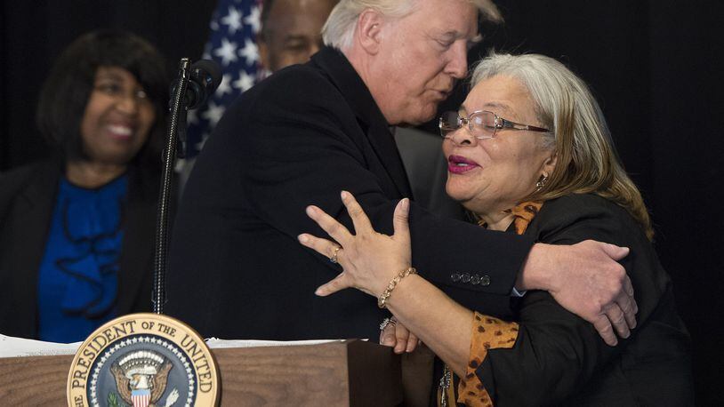 WASHINGTON, DC - FEBRUARY 21: (AFP OUT) President Donald Trump hugs Alveda King, niece of Martin Luther King Jr., as he delivers remarks after touring the Smithsonian National Museum of African American History & Culture on February 21, 2017 in Washington, DC. (Photo by Kevin Dietsch - Pool/Getty Images)
