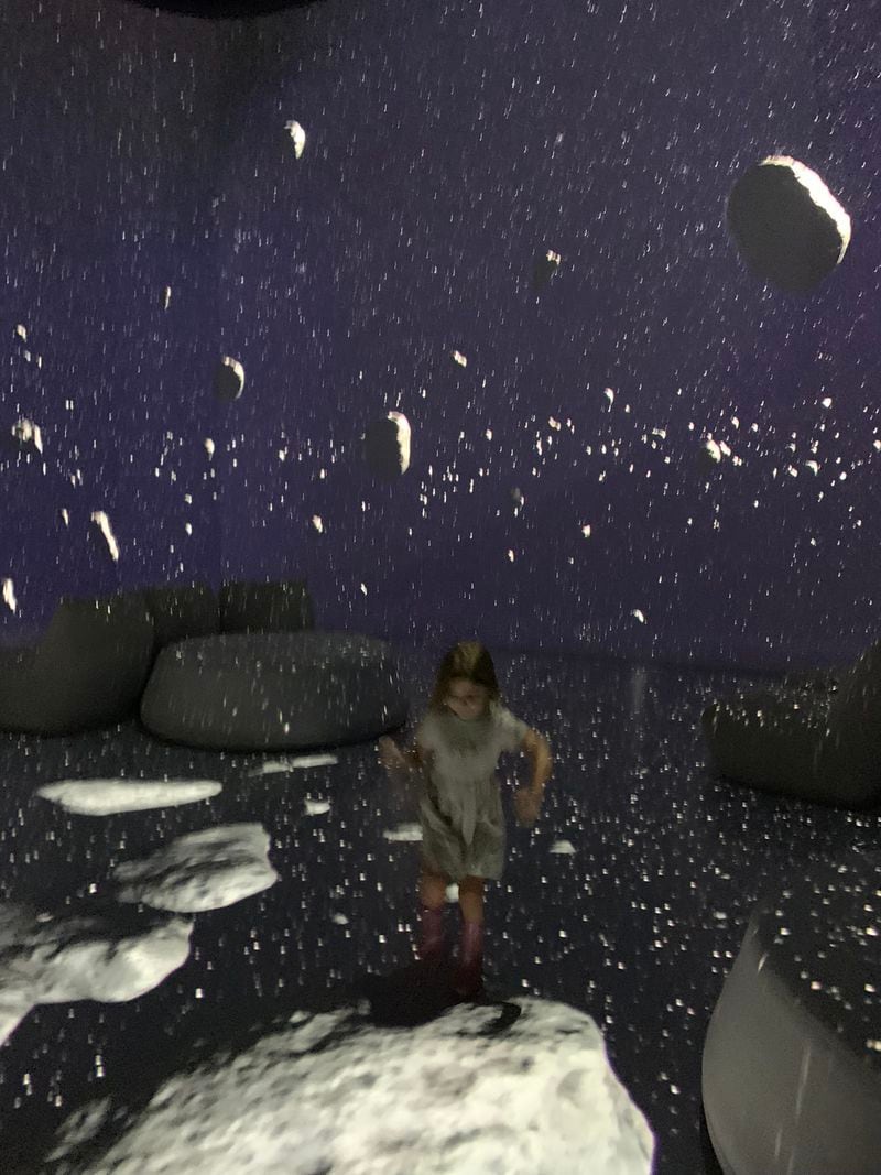 The Kuiper Belt portion of the Illuminarium "Space" experience involves stepping and breaking space rocks. RODNEY HO/rho@ajc.com