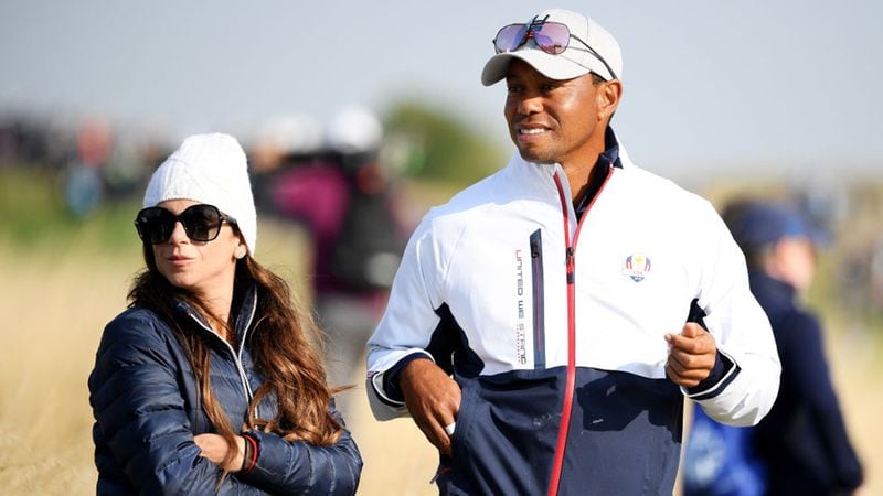Tiger Woods of the United States watches on with girlfriend Erica Herman during the afternoon foursome matches of the 2018 Ryder Cup at Le Golf National on September 28, 2018 in Paris, France.