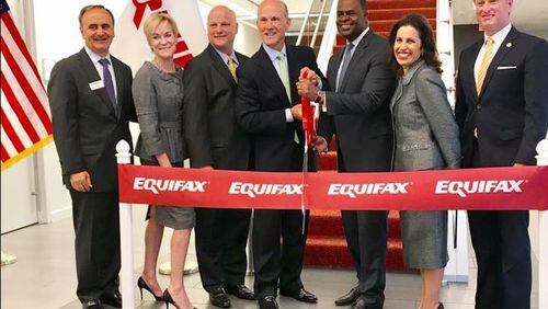 Mayor Kasim Reed cuts the ribbon at the grand opening of Equifax’s newest location which will bring 800 jobs to Midtown. CONTRIBUTED