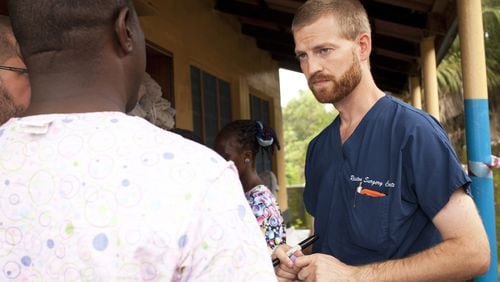 MONROVIA, LIBERIA - UNSPECIFIED DATE:In this handout provided by Samaritan's Purse, Dr. Kent Brantly (R), one of the two Americans who contracted Ebola, works at an Ebola isolation ward at a mission hospital outside of Monrovia, Liberia. Brantly arrived on U.S. soil after contracting the deadly disease and is showing signs of improvement as he is treated at Emory University Hospital in Atlanta, Georgia. (Photo by Samaritans Purse via Getty Images)