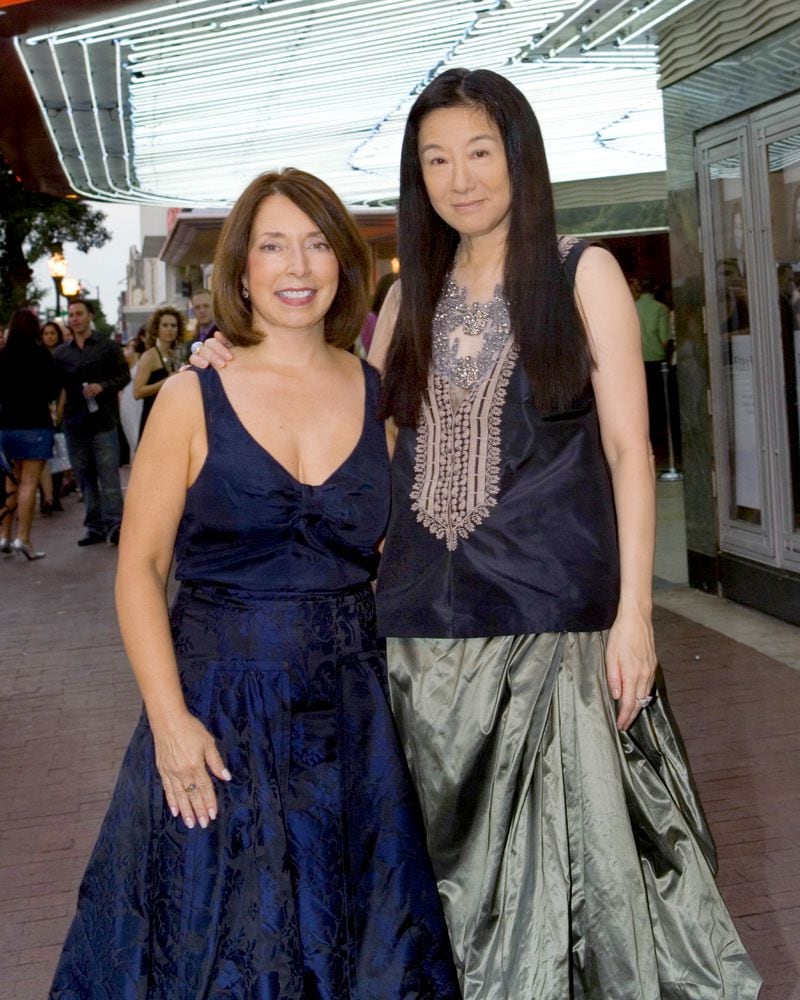 Paula Wallace, president of the Savannah College of Art and Design, left, poses with the fashion designer Vera Wang during a SCAD event in 2006. Wallace often walks the red carpet with celebrity visitors to the school. (AJC file)