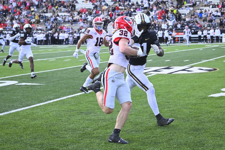 Georgia running back Cash Jones (32) makes a first down on a long gain against Vanderbilt during the second half of an NCAA football game, Saturday, Oct. 14, 2023, in Nashville, Tenn. Georgia won 37-20. (Special to the AJC/John Amis)