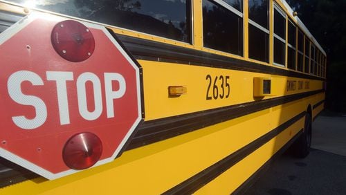 A Gwinnett County school bus with a video camera. KENT D. JOHNSON/KDJOHNSON@AJC.COM