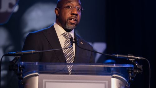 Polls have shown that Democratic U.S. Sen. Raphael Warnock is running several points ahead of his party's nominee for governor, Stacey Abrams, lending support to suggestions that a significant number of Georgia voters could split their tickets this fall. (Nathan Posner for the Atlanta Journal-Constitution)