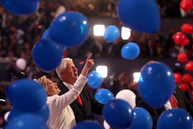 PHILADELPHIA, PA - JULY 28: Democratic presidential candidate Hillary Clinton and her husband, former US President Bill Clinton, acknowledges the crowd at the end of the fourth day of the Democratic National Convention at the Wells Fargo Center, July 28, 2016 in Philadelphia, Pennsylvania. Democratic presidential candidate Hillary Clinton received the number of votes needed to secure the party's nomination. An estimated 50,000 people are expected in Philadelphia, including hundreds of protesters and members of the media. The four-day Democratic National Convention kicked off July 25. (Photo by Justin Sullivan/Getty Images)