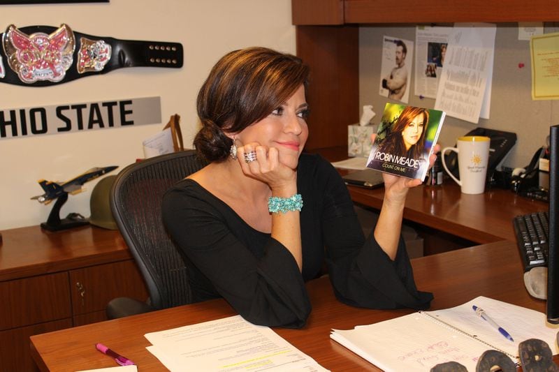 Robin Meade poses with her new CD, “Count on Me,” in her offices at CNN in downtown Atlanta. MELISSA RUGGIERI / MRUGGIERI@AJC.COM