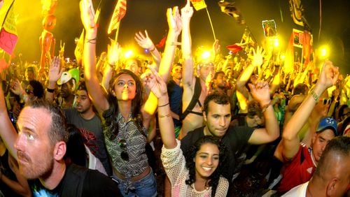 A crowd dances to electronic beats at the TomorrowWorld electronic music festival in Chattahoochee Hills, South of Atlanta, on Saturday, Sept. 27, 2014. HYOSUB SHIN / HSHIN@AJC.COM