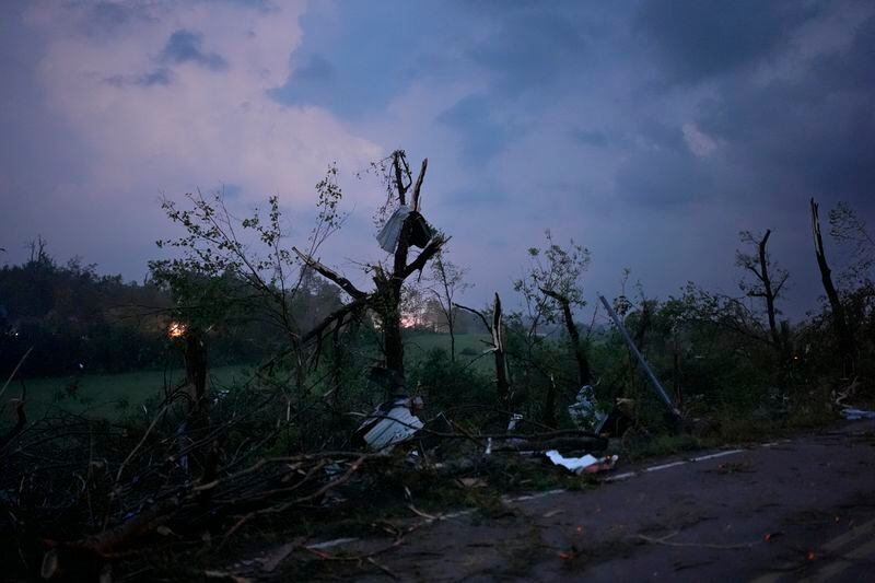 Storm debris litters a portion of Cranford Hollow Road, Wednesday, May 8, 2024, in Columbia, Tenn. (AP Photo/George Walker IV)