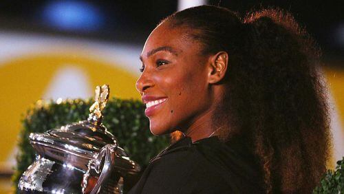 Tennis champ Serena Williams poses with the Daphne Akhurst Memorial Cup after winning the 2017 Women's Singles Australian Open Championship at Melbourne Park on January 28, 2017 in Melbourne, Australia.