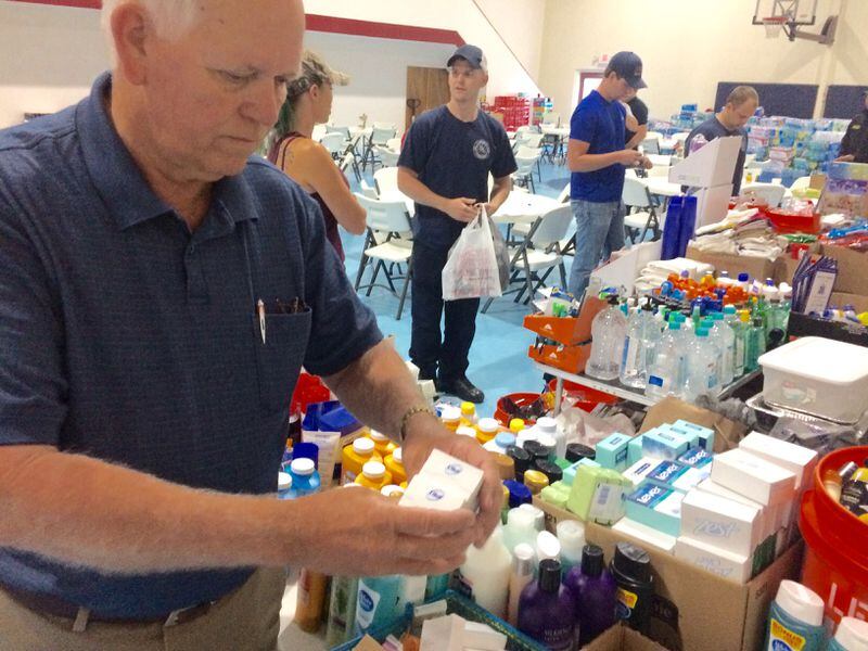 Pastor Grady Allbritton of St. George Church of God prepares for another morning of feeding and gathering donated goods for firefighters battling the wildfire in South Georgia. Photo/CRAIG SCHNEIDER