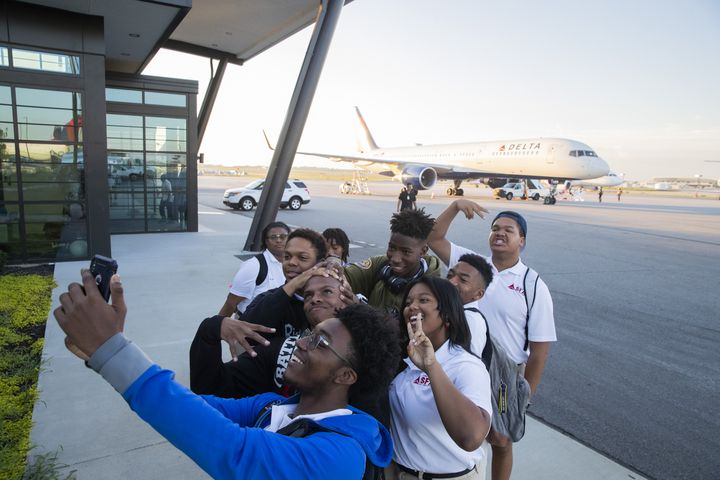 Khye Felder, 17, takes a selfie with other students of the Solo Flight Academy as they walk to board a plane as part of Delta’s Dream Flight 2022 event at Hartsfield-Jackson Atlanta International Airport on Friday, July 15, 2022. Around 150 students ranging from 13 to 18 years old will fly from Atlanta to the Duluth Air National Guard Base in Duluth, Minnesota. (Chris Day/Christopher.Day@ajc.com)