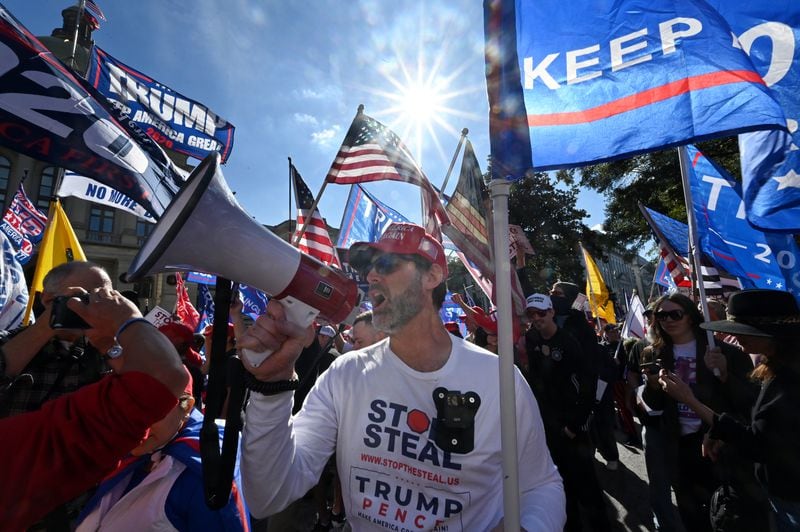 Pro-Trump protesters, some with flags and signs, attend a rally against the results of the U.S. presidential election outside the Georgia State Capitol on Saturday, November 21, 2020. Several different groups converged at the Capitol for a rally to show support for and against President Donald Trump. (Photo: Hyosub Shin / Hyosub.Shin@ajc.com)