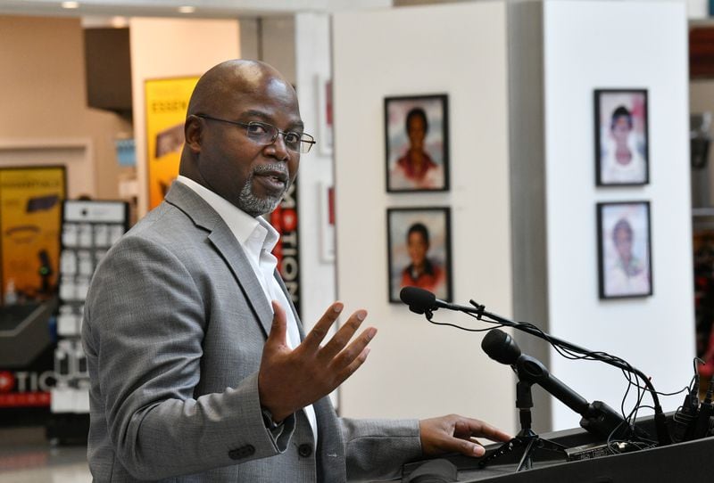 Artist Dwayne Mitchell speaks during an event to announce the exhibition of the Atlanta Children's Memorial Portraits at Hartsfield-Jackson Atlanta International Airport on Wednesday, June 30, 2021. Artist Dwayne Mitchell was commissioned to create 30 portraits memorializing each victim of the Atlanta Child Murders. (Hyosub Shin / Hyosub.Shin@ajc.com)